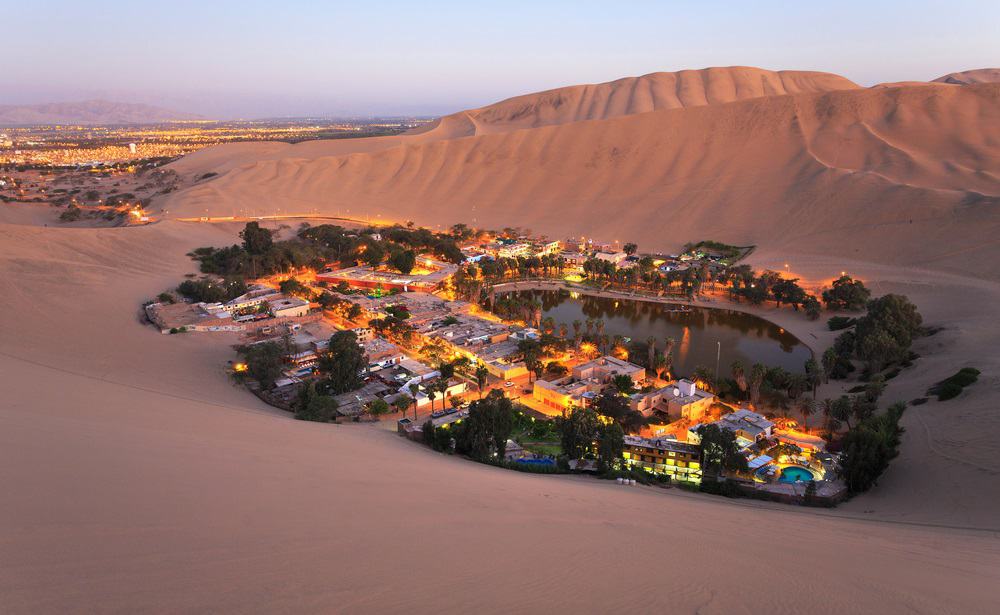 Sunset in oasis Huacachina near the city of Ica, Peru