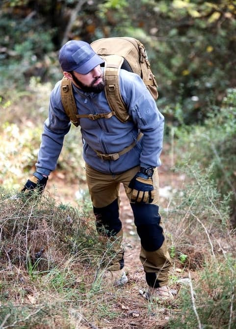 man backpacking a trail