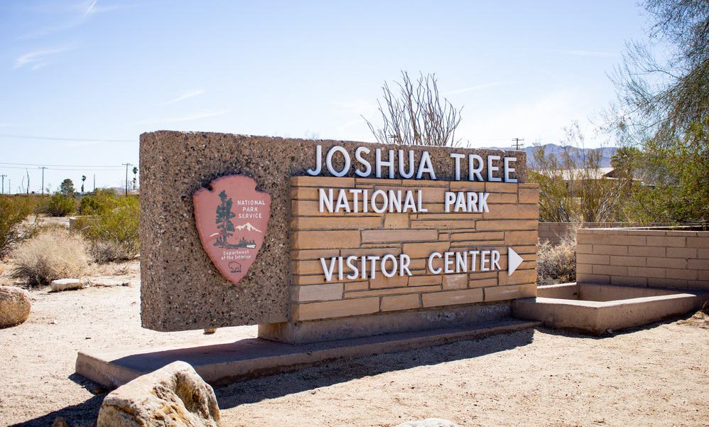 view of an entrance sign for the Joshua Tree National Park Visitor Center